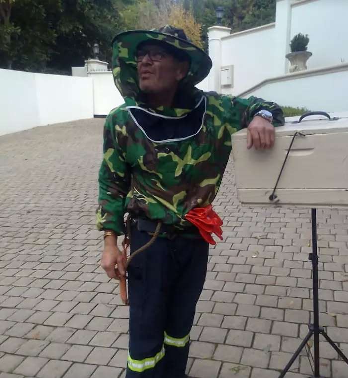 Charles in a bee suit on a callout in Bishopscourt